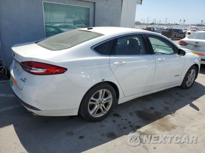 Trzecie zdjęcie samochodu z tyłu: 2018 FORD FUSION SE HYBRID VIN:3FA6P0LU1JR278630 - miniatura