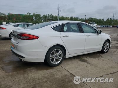 Trzecie zdjęcie samochodu z tyłu: 2018 FORD FUSION SE HYBRID VIN:3FA6P0LU8JR172028 - miniatura