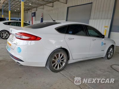 Trzecie zdjęcie samochodu z tyłu: 2017 FORD FUSION SE HYBRID VIN:3FA6P0LU5HR409388 - miniatura