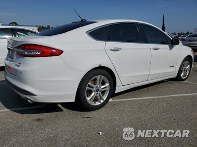 Trzecie zdjęcie samochodu z tyłu: 2018 FORD FUSION SE HYBRID VIN:3FA6P0LU8JR281878 - miniatura