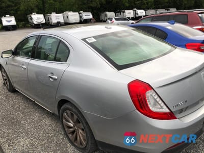 Trzecie zdjęcie samochodu z tyłu: 2014 LINCOLN MKS VIN:1LNHL9EK3EG609885 - miniatura