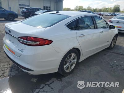 Trzecie zdjęcie samochodu z tyłu: 2018 FORD FUSION SE HYBRID VIN:3FA6P0LU6JR129923 - miniatura