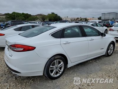 Trzecie zdjęcie samochodu z tyłu: 2018 FORD FUSION SE HYBRID VIN:3FA6P0LU0JR278697 - miniatura