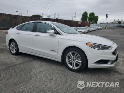 Czwarte zdjęcie samochodu z boku: 2018 FORD FUSION SE HYBRID VIN:3FA6P0LUXJR172127 - miniatura