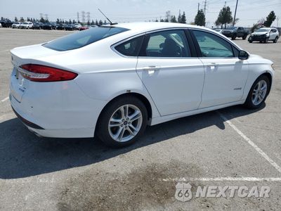 Trzecie zdjęcie samochodu z tyłu: 2018 FORD FUSION SE HYBRID VIN:3FA6P0LU3JR152463 - miniatura
