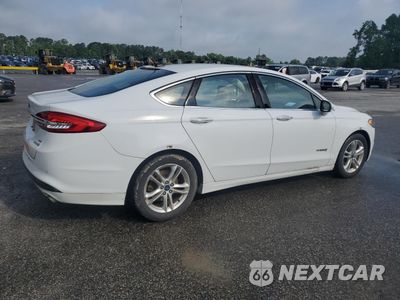 Trzecie zdjęcie samochodu z tyłu: 2018 FORD FUSION SE HYBRID VIN:3FA6P0LU1JR171724 - miniatura