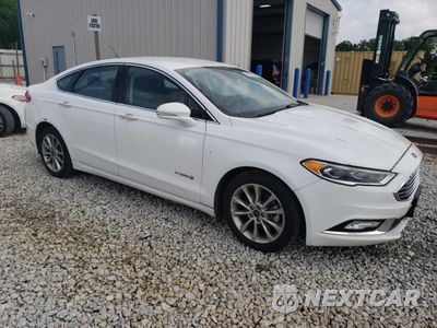 Czwarte zdjęcie samochodu z boku: 2017 FORD FUSION SE HYBRID VIN:3FA6P0LU7HR410087 - miniatura