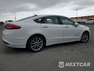 Trzecie zdjęcie samochodu z tyłu: 2017 FORD FUSION SE HYBRID VIN:3FA6P0LU9HR409765 - miniatura