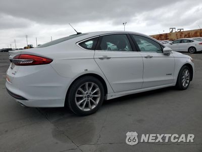 Trzecie zdjęcie samochodu z tyłu: 2017 FORD FUSION SE HYBRID VIN:3FA6P0LU5HR409746 - miniatura