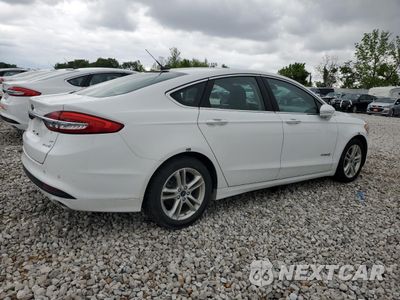 Trzecie zdjęcie samochodu z tyłu: 2018 FORD FUSION SE HYBRID VIN:3FA6P0LU0JR118609 - miniatura