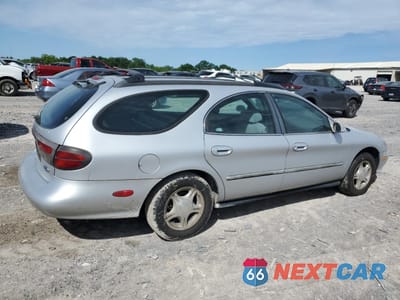 Trzecie zdjęcie samochodu z tyłu: 1999 FORD TAURUS SE VIN:1FAFP58UXXA313979 - miniatura