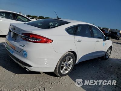 Trzecie zdjęcie samochodu z tyłu: 2018 FORD FUSION SE HYBRID VIN:3FA6P0LUXJR163508 - miniatura