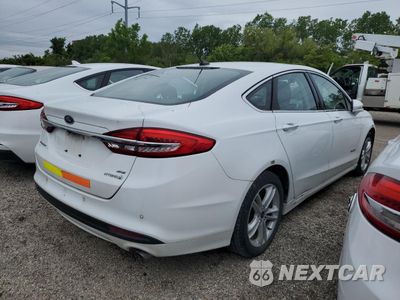 Trzecie zdjęcie samochodu z tyłu: 2018 FORD FUSION SE HYBRID VIN:3FA6P0LU5JR172021 - miniatura