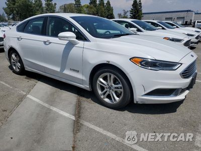 Czwarte zdjęcie samochodu z boku: 2018 FORD FUSION SE HYBRID VIN:3FA6P0LU3JR172115 - miniatura