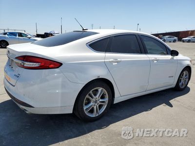 Trzecie zdjęcie samochodu z tyłu: 2018 FORD FUSION SE HYBRID VIN:3FA6P0LU3JR172132 - miniatura