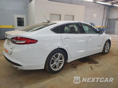 Trzecie zdjęcie samochodu z tyłu: 2018 FORD FUSION SE HYBRID VIN:3FA6P0LU6JR171802 - miniatura