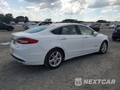 Trzecie zdjęcie samochodu z tyłu: 2018 FORD FUSION SE HYBRID VIN:3FA6P0LU8JR129941 - miniatura