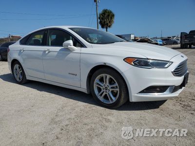 Czwarte zdjęcie samochodu z boku: 2018 FORD FUSION SE HYBRID VIN:3FA6P0LU2JR118613 - miniatura