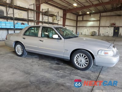 Czwarte zdjęcie samochodu z boku: 2010 MERCURY GRAND MARQUIS LS VIN:2MEBM7FV9AX622090 - miniatura