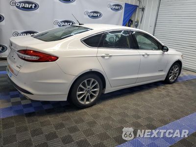 Trzecie zdjęcie samochodu z tyłu: 2017 FORD FUSION SE HYBRID VIN:3FA6P0LU1HR409498 - miniatura