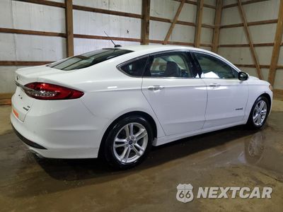 Trzecie zdjęcie samochodu z tyłu: 2018 FORD FUSION SE HYBRID VIN:3FA6P0LUXJR172032 - miniatura