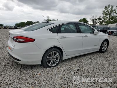 Trzecie zdjęcie samochodu z tyłu: 2018 FORD FUSION SE HYBRID VIN:3FA6P0LU3JR171854 - miniatura