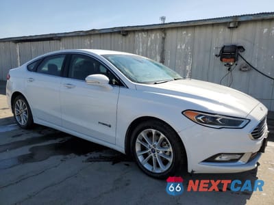 Czwarte zdjęcie samochodu z boku: 2017 FORD FUSION SE HYBRID VIN:3FA6P0LU7HR409523 - miniatura