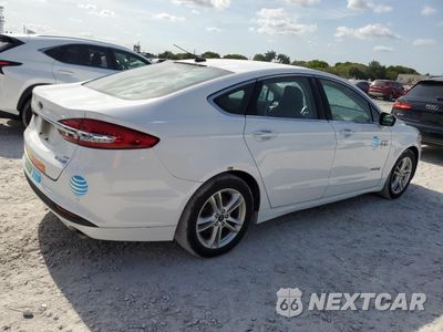 Trzecie zdjęcie samochodu z tyłu: 2018 FORD FUSION SE HYBRID VIN:3FA6P0LU1JR129912 - miniatura