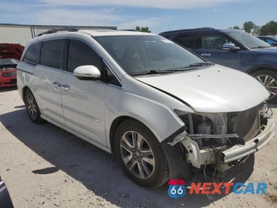 Czwarte zdjęcie samochodu z boku: 2016 HONDA ODYSSEY TOURING VIN:5FNRL5H9XGB127428 - miniatura