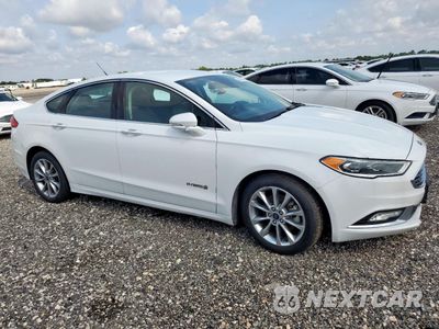 Czwarte zdjęcie samochodu z boku: 2017 FORD FUSION SE HYBRID VIN:3FA6P0LU5HR409603 - miniatura