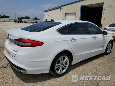 Trzecie zdjęcie samochodu z tyłu: 2018 FORD FUSION SE HYBRID VIN:3FA6P0LU3JR171840 - miniatura
