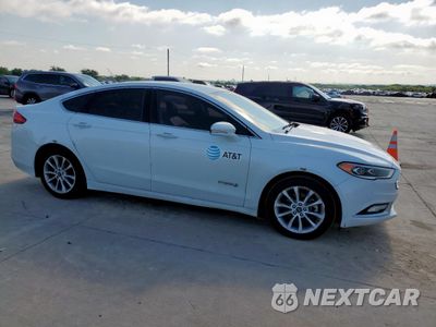 Czwarte zdjęcie samochodu z boku: 2017 FORD FUSION SE HYBRID VIN:3FA6P0LU9HR410155 - miniatura