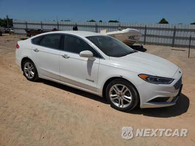 Czwarte zdjęcie samochodu z boku: 2018 FORD FUSION SE HYBRID VIN:3FA6P0LU0JR171844 - miniatura