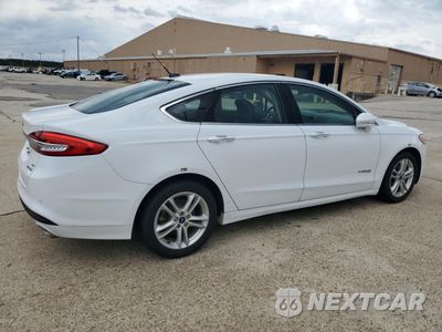 Trzecie zdjęcie samochodu z tyłu: 2018 FORD FUSION SE HYBRID VIN:3FA6P0LU4JR118838 - miniatura