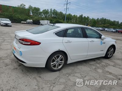 Trzecie zdjęcie samochodu z tyłu: 2018 FORD FUSION SE HYBRID VIN:3FA6P0LU0JR118822 - miniatura