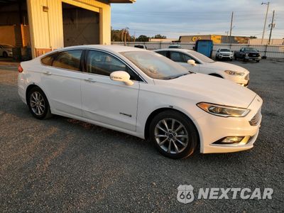 Czwarte zdjęcie samochodu z boku: 2017 FORD FUSION SE HYBRID VIN:3FA6P0LU8HR409577 - miniatura