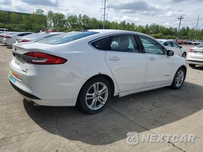 Trzecie zdjęcie samochodu z tyłu: 2018 FORD FUSION SE HYBRID VIN:3FA6P0LU0JR172041 - miniatura