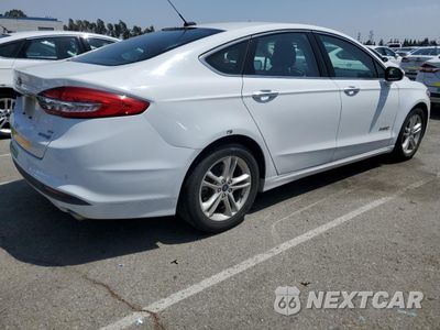 Trzecie zdjęcie samochodu z tyłu: 2018 FORD FUSION SE HYBRID VIN:3FA6P0LU6JR172108 - miniatura