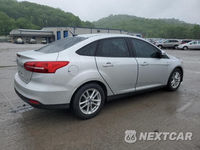 Trzecie zdjęcie samochodu z tyłu: 2018 FORD FOCUS SE VIN:1FADP3F29JL309706 - miniatura