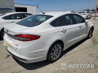 Trzecie zdjęcie samochodu z tyłu: 2017 FORD FUSION SE HYBRID VIN:3FA6P0LU2HR408912 - miniatura