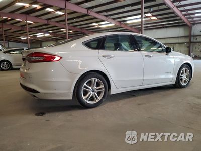 Trzecie zdjęcie samochodu z tyłu: 2018 FORD FUSION SE HYBRID VIN:3FA6P0LU6JR163490 - miniatura