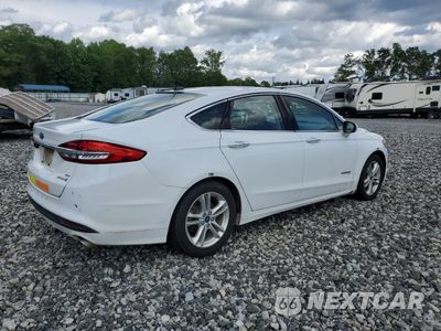 Trzecie zdjęcie samochodu z tyłu: 2018 FORD FUSION SE HYBRID VIN:3FA6P0LU3JR171773 - miniatura