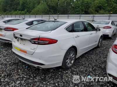 Czwarte zdjęcie samochodu z boku: 2017 FORD FUSION SE HYBRID VIN:3FA6P0LU1HR409274 - miniatura