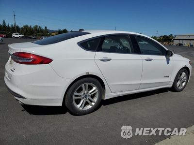 Trzecie zdjęcie samochodu z tyłu: 2017 FORD FUSION SE HYBRID VIN:3FA6P0LU9HR409149 - miniatura