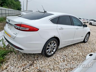 Trzecie zdjęcie samochodu z tyłu: 2017 FORD FUSION SE HYBRID VIN:3FA6P0LU7HR409182 - miniatura