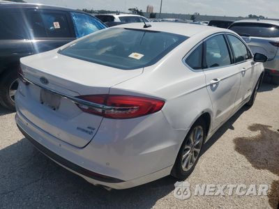 Trzecie zdjęcie samochodu z tyłu: 2017 FORD FUSION SE HYBRID VIN:3FA6P0LU9HR409555 - miniatura