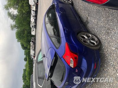 Czwarte zdjęcie samochodu z boku: 2014 FORD FOCUS ST VIN:1FADP3L90EL172288 - miniatura