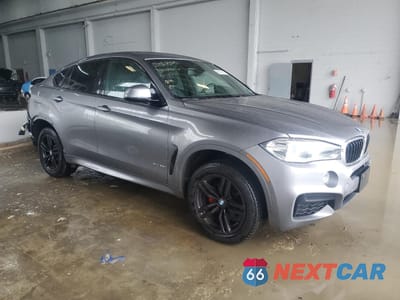 Czwarte zdjęcie samochodu z boku: 2019 BMW X6 XDRIVE35I VIN:5UXKU2C58K0Z65951 - miniatura