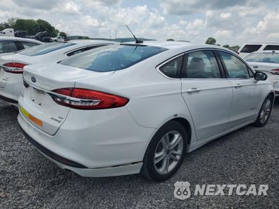 Trzecie zdjęcie samochodu z tyłu: 2018 FORD FUSION SE HYBRID VIN:3FA6P0LU3JR171952 - miniatura
