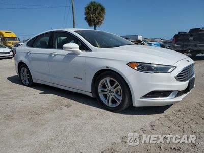 Czwarte zdjęcie samochodu z boku: 2018 FORD FUSION SE HYBRID VIN:3FA6P0LU4JR163519 - miniatura